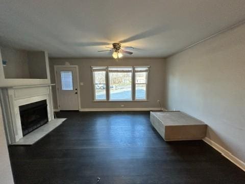 unfurnished living room featuring ceiling fan