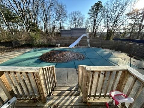 view of pool with a water slide