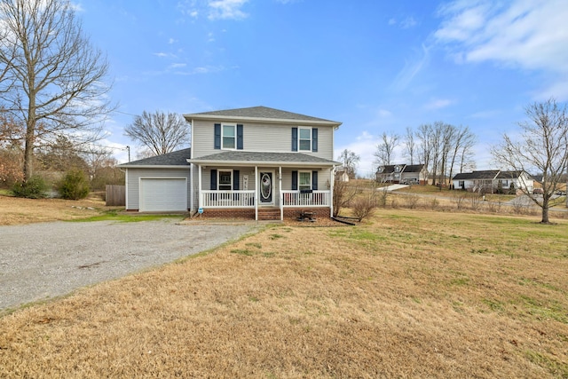 view of front of home featuring a garage, covered porch, and a front lawn