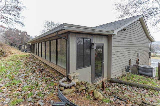 view of side of home with a sunroom