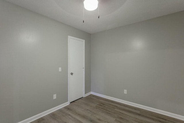 unfurnished room featuring ceiling fan and wood-type flooring