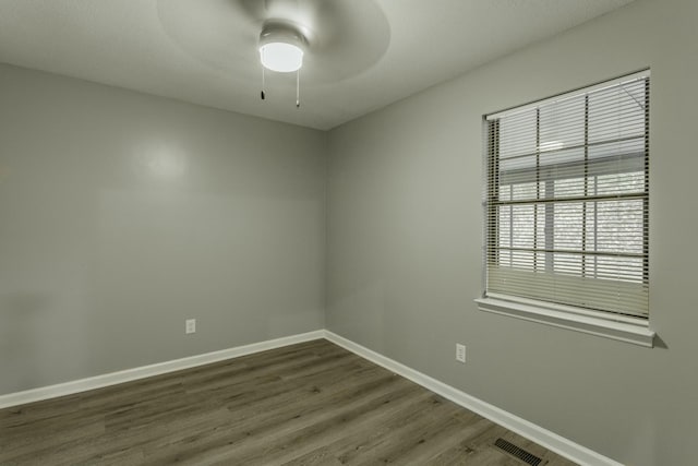 unfurnished room featuring ceiling fan and wood-type flooring