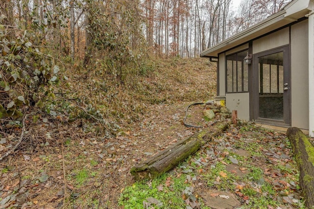 view of yard with a sunroom