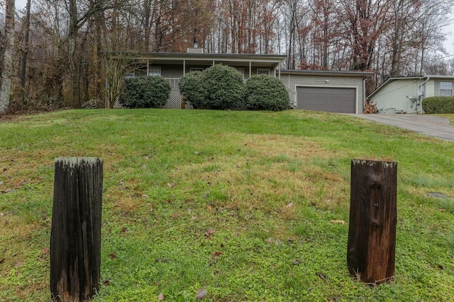 ranch-style home with a front yard and a garage