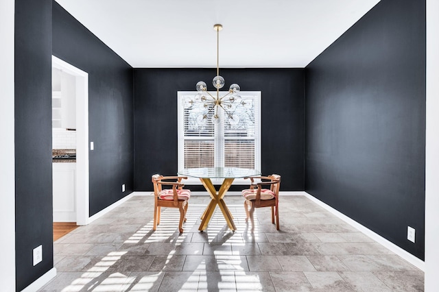 dining space with an inviting chandelier