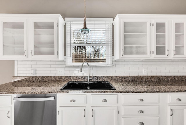 kitchen with pendant lighting, white cabinetry, and stainless steel dishwasher