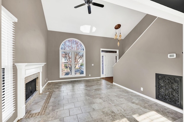 unfurnished living room featuring ceiling fan and lofted ceiling