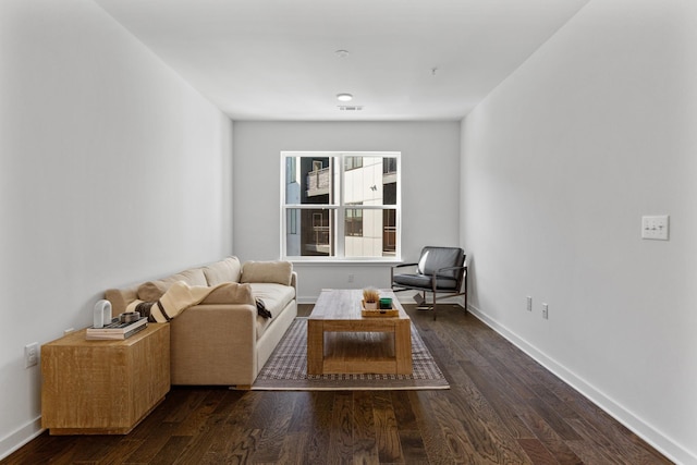 living area with dark hardwood / wood-style flooring