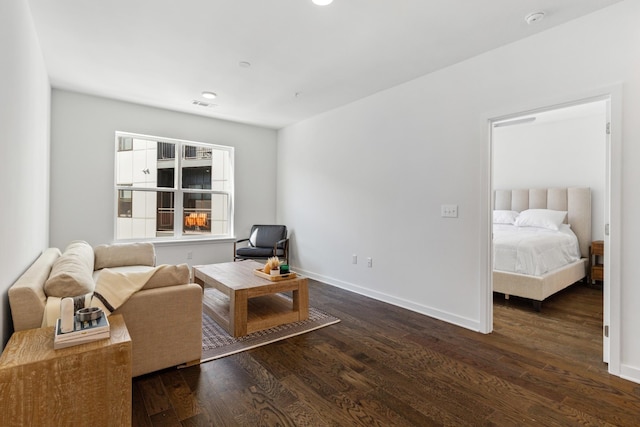 living area with dark hardwood / wood-style floors