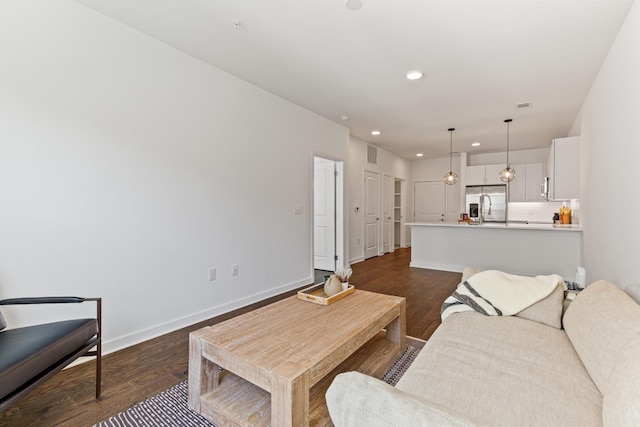 living room featuring dark wood-type flooring