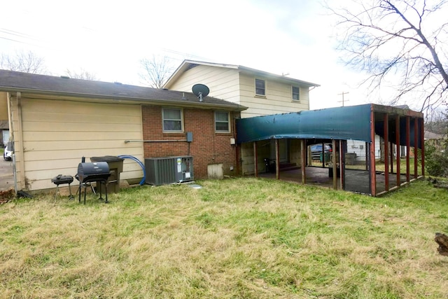 back of house with a yard and cooling unit