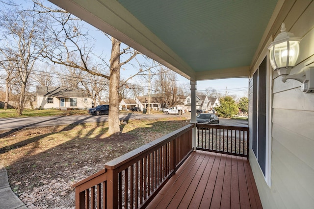 wooden terrace with a porch