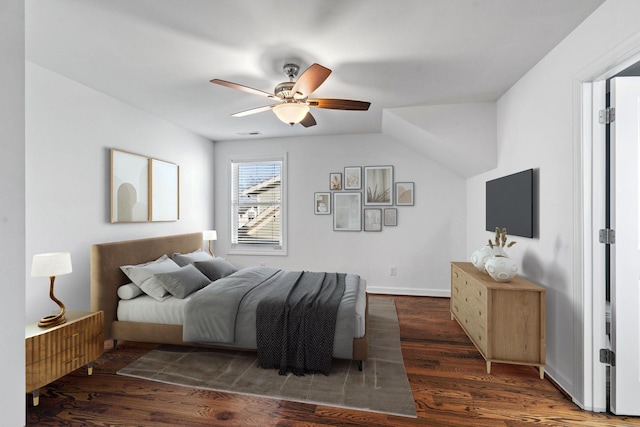 bedroom with ceiling fan and dark wood-type flooring