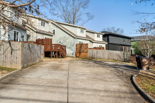 back of property with a wooden deck