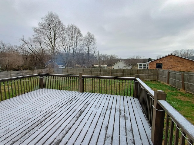 wooden terrace with a lawn