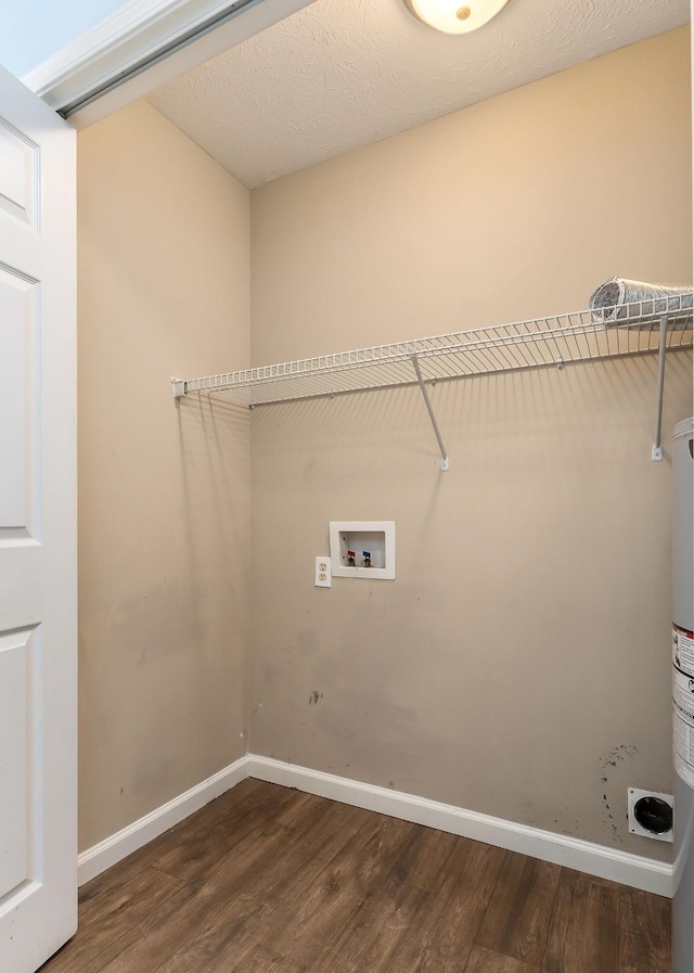 laundry area featuring hardwood / wood-style floors and washer hookup