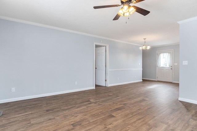 empty room featuring dark wood-type flooring, ceiling fan with notable chandelier, and ornamental molding