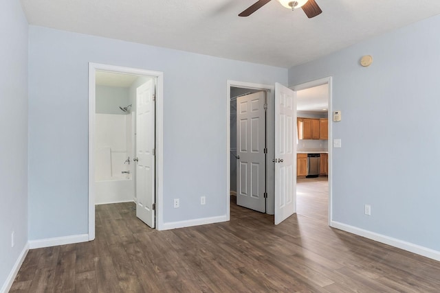 unfurnished bedroom with dark hardwood / wood-style flooring, ensuite bath, and ceiling fan