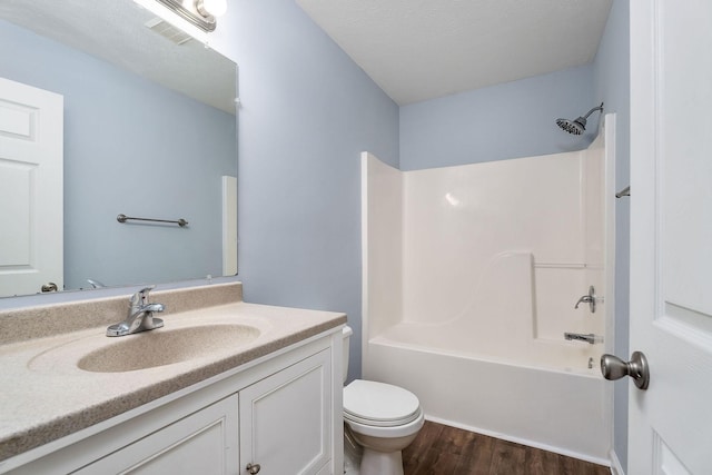 full bathroom featuring shower / bathing tub combination, vanity, toilet, and wood-type flooring