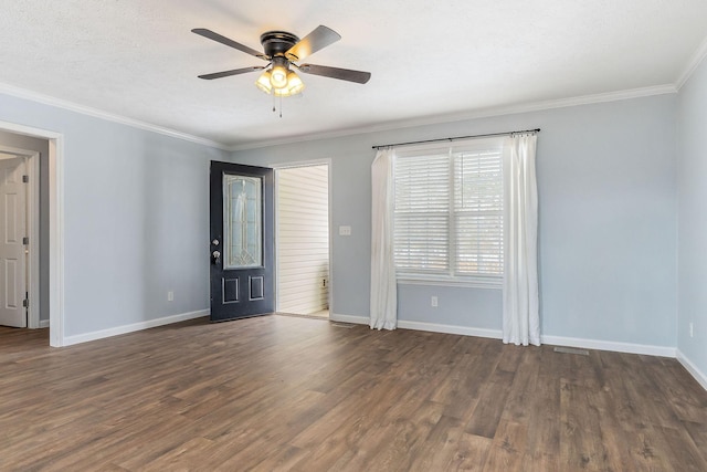 interior space featuring ceiling fan, dark hardwood / wood-style flooring, and ornamental molding