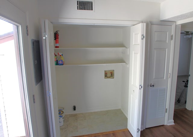 laundry room with wood-type flooring and hookup for a washing machine