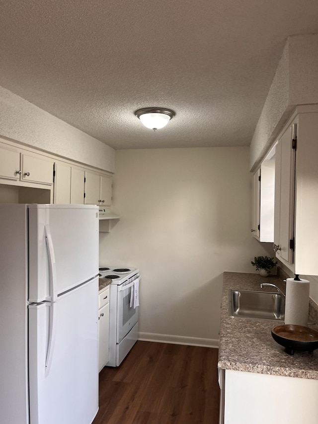 kitchen with sink, white cabinets, dark hardwood / wood-style flooring, white appliances, and a textured ceiling