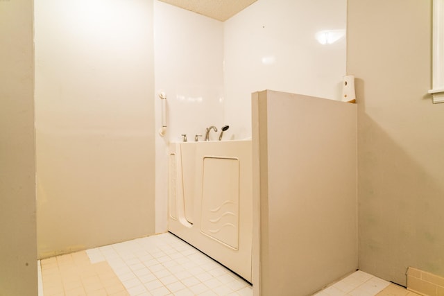 bathroom with a textured ceiling