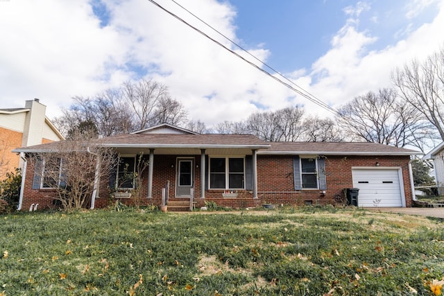 view of front of property with a front lawn, covered porch, and a garage