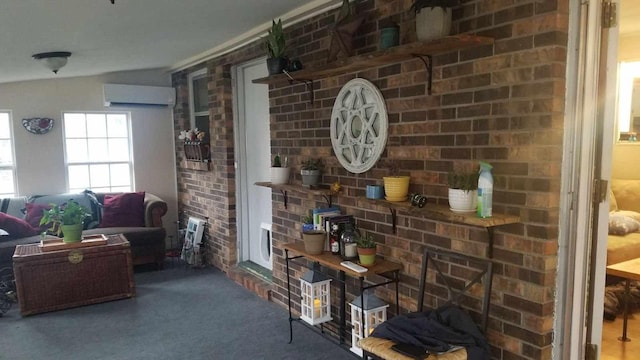 interior space featuring brick wall, carpet floors, and a wall unit AC