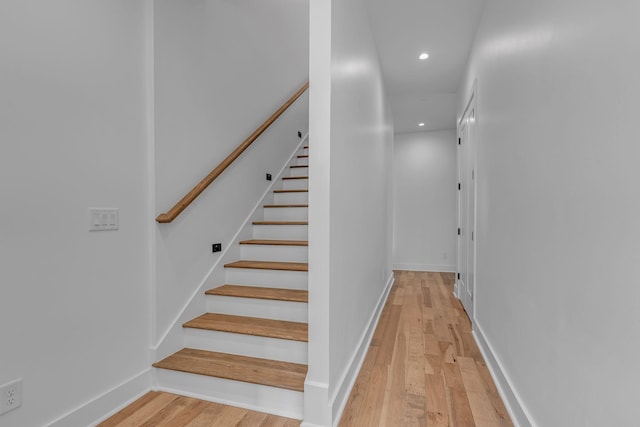 stairs with hardwood / wood-style flooring, baseboards, and recessed lighting