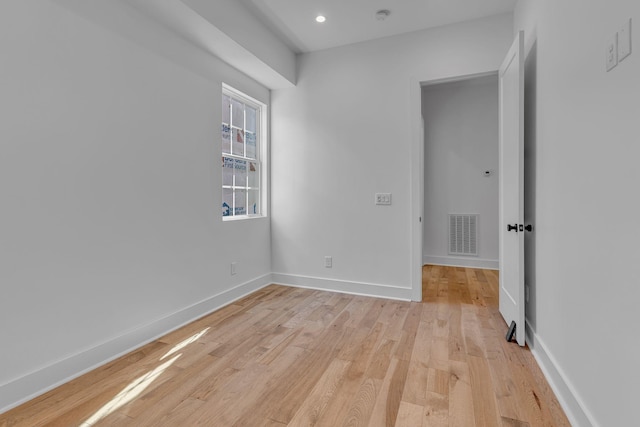 spare room with recessed lighting, baseboards, visible vents, and light wood finished floors