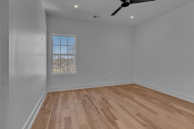 spare room with light wood-type flooring, ceiling fan, baseboards, and recessed lighting