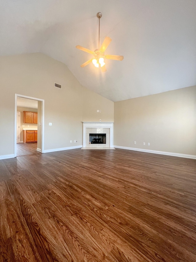 unfurnished living room with dark hardwood / wood-style flooring, ceiling fan, and lofted ceiling