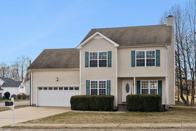 view of front of house featuring a front yard and a garage