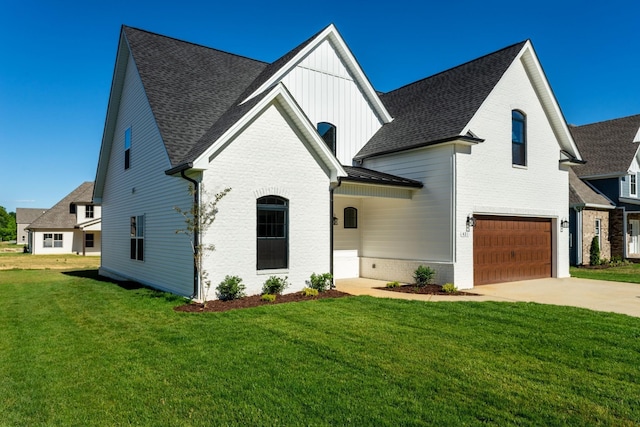 view of front facade with a front lawn and a garage