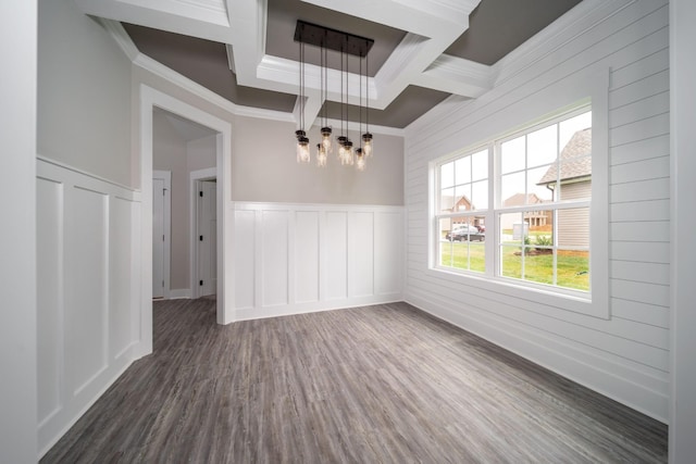 unfurnished dining area with beamed ceiling, crown molding, dark wood-type flooring, and coffered ceiling