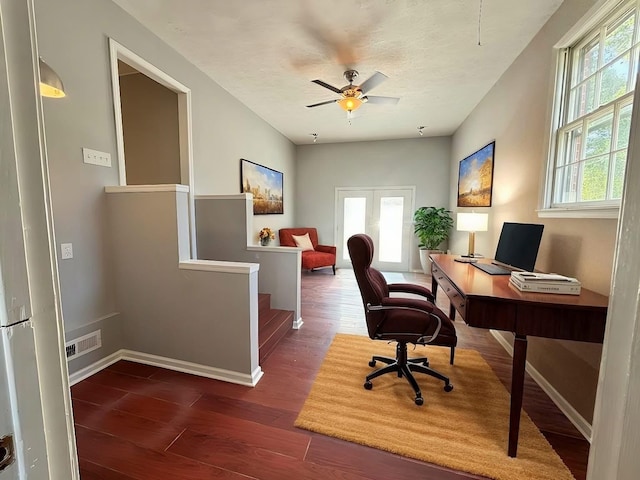 home office featuring dark hardwood / wood-style floors and ceiling fan