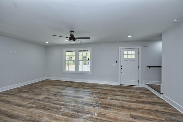 entryway featuring ceiling fan and dark wood-type flooring