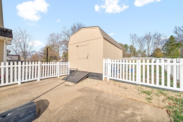 view of patio with a storage shed