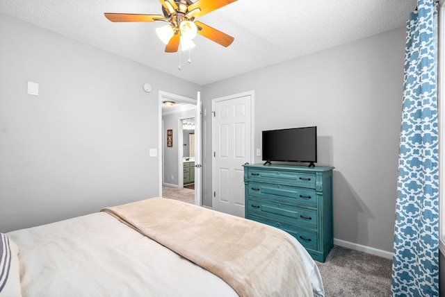 bedroom with ceiling fan, light colored carpet, and a textured ceiling