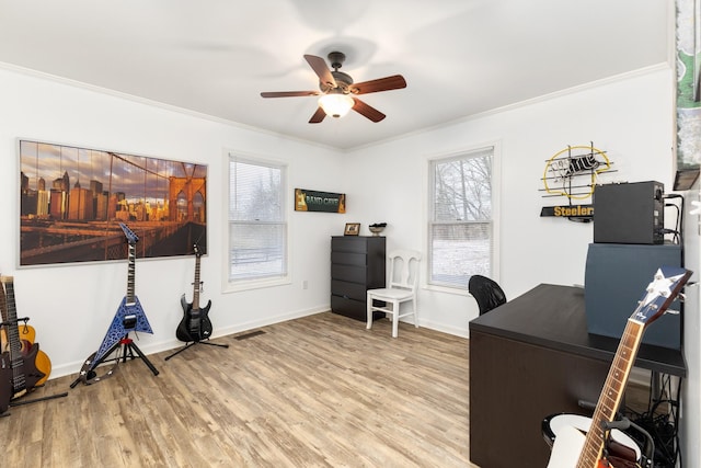 office area featuring ceiling fan, hardwood / wood-style floors, and ornamental molding