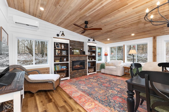 living room with a wall mounted air conditioner, hardwood / wood-style floors, lofted ceiling, a fireplace, and wood ceiling