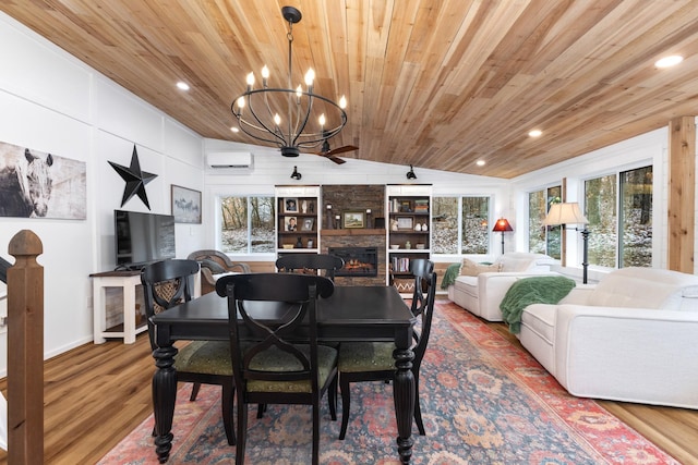 dining space featuring a fireplace, hardwood / wood-style floors, and wood ceiling