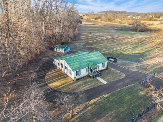 birds eye view of property with a rural view