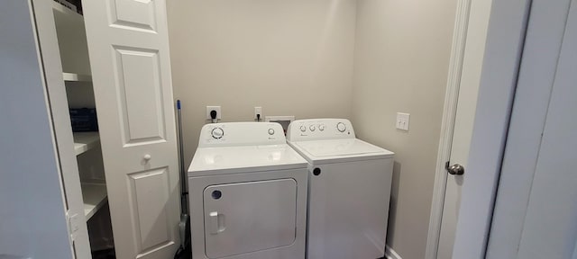 washroom featuring independent washer and dryer