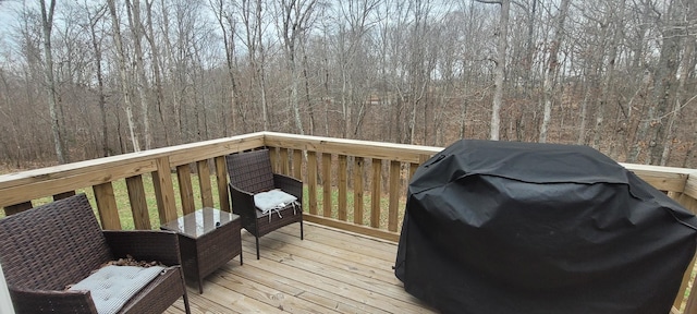 wooden terrace with area for grilling