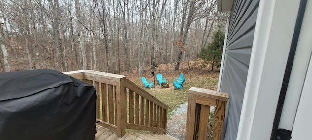 wooden deck with a grill