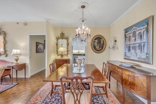 dining area featuring crown molding, light parquet flooring, and an inviting chandelier