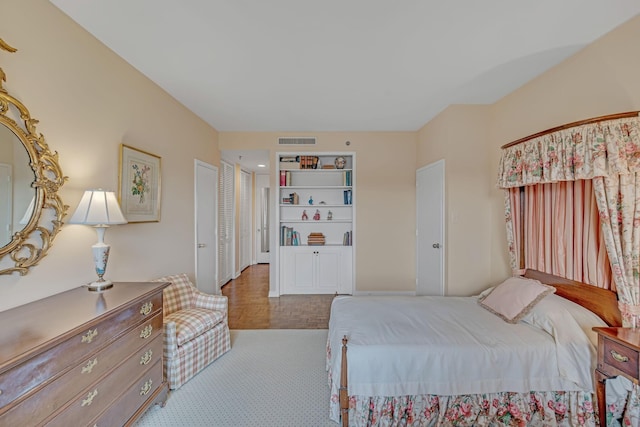 bedroom with light parquet floors