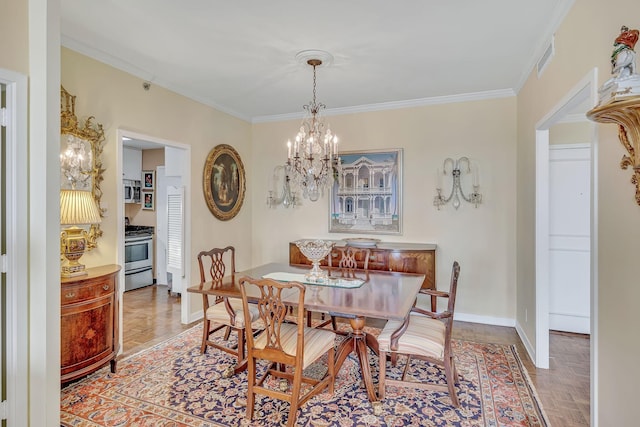 dining room with parquet floors, a notable chandelier, and ornamental molding